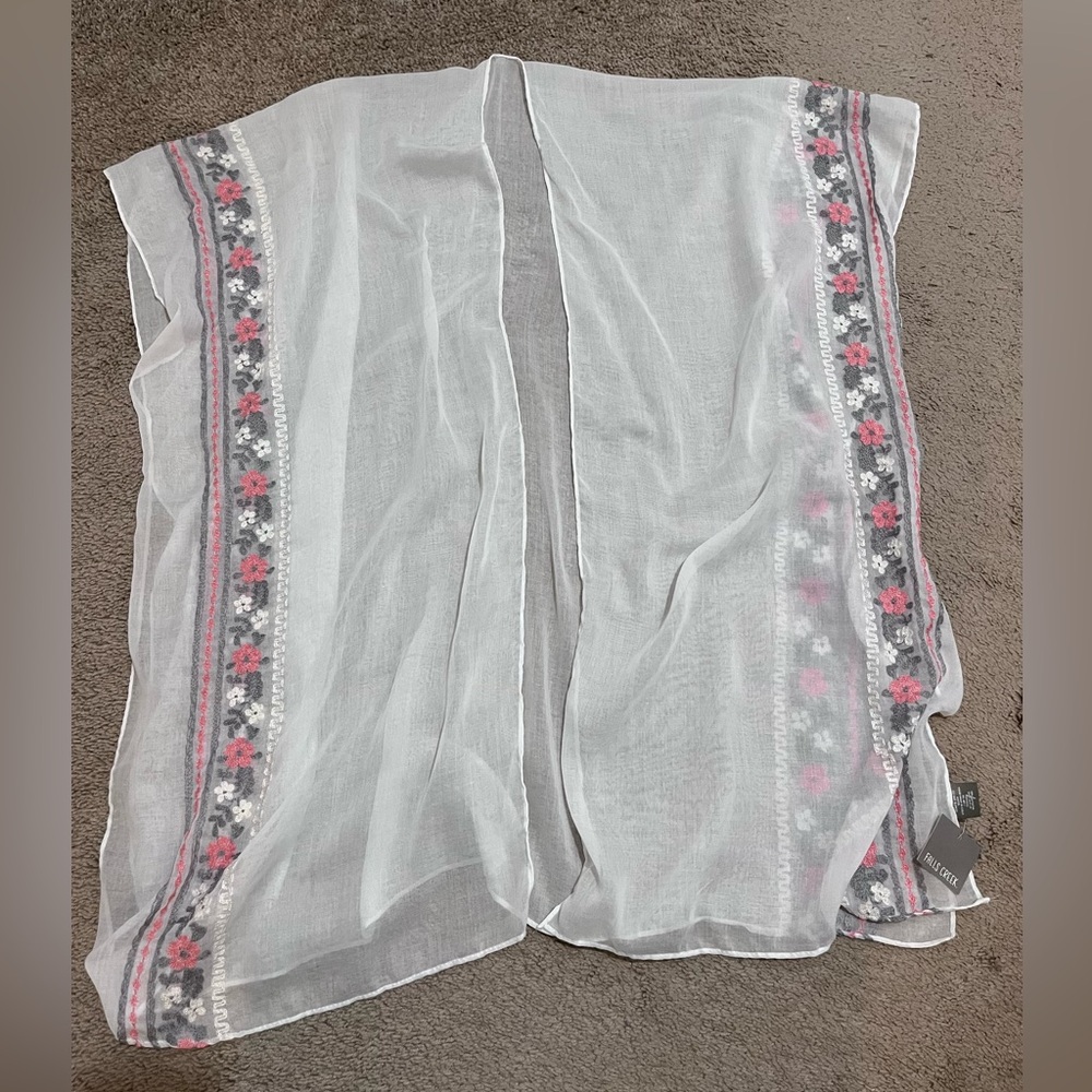 This is a lovely shawl that is brand new with original tags on it.